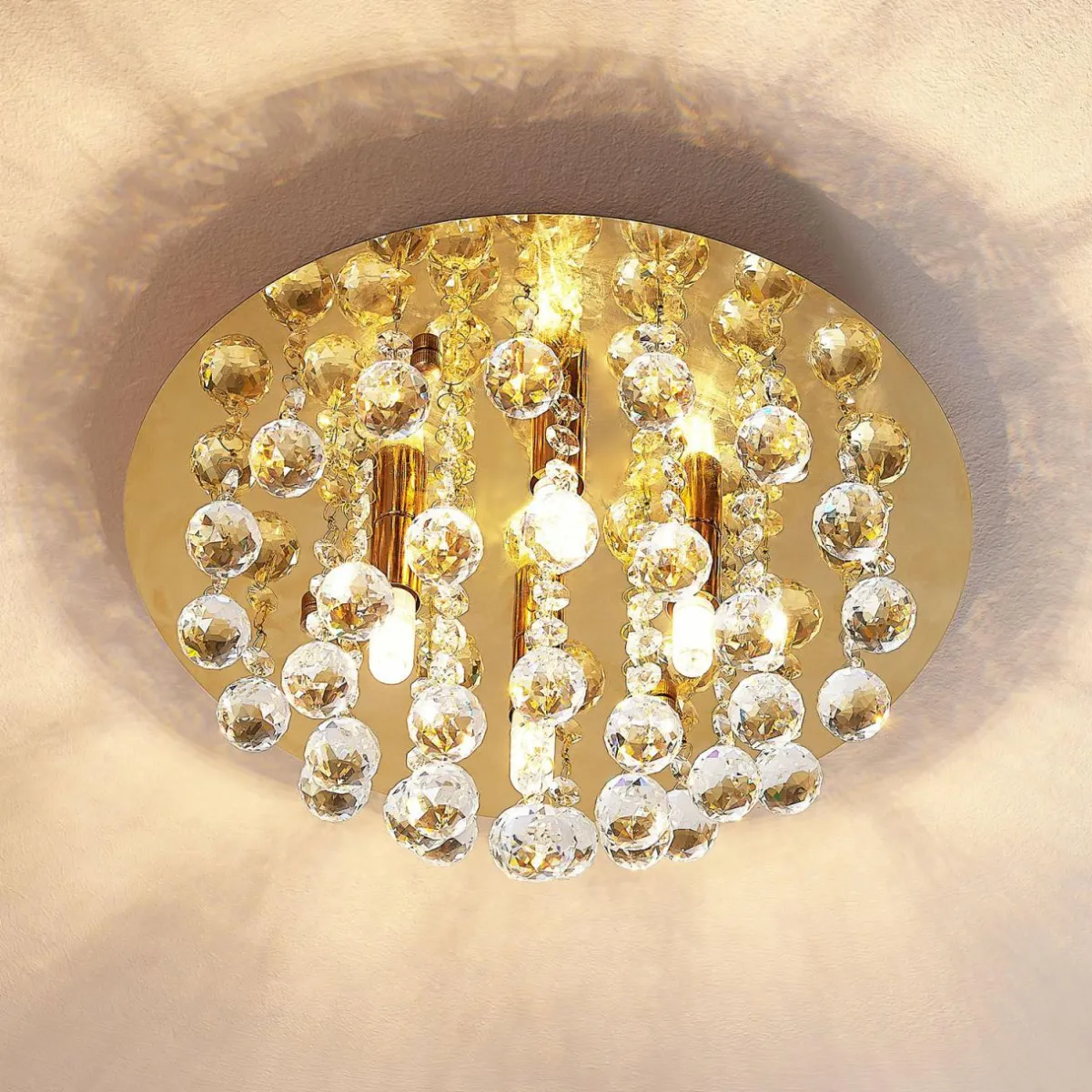 lindby_plafonnier_gillion__lampes_dor_cristal_1.webp Online Lindby plafonnier Gillion, 4 lampes, doré, cristal