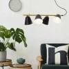 Store Näve Suspension Triton noire et dorée, quatre lampes